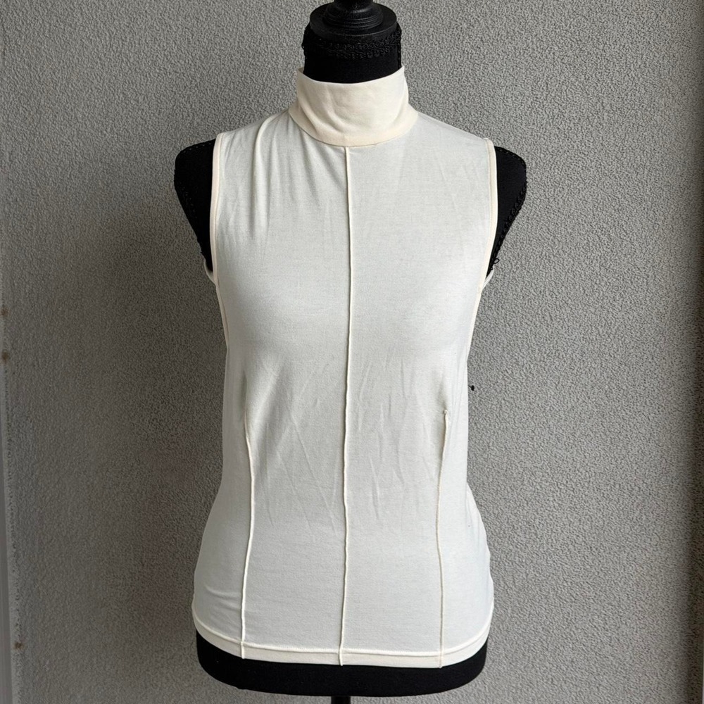 Reformation cream top with high neck and open back detail Size M